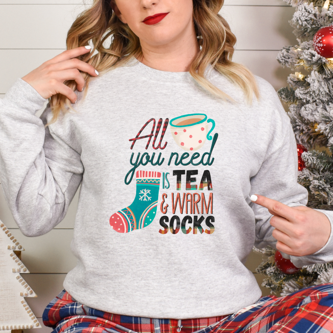 Cozy up this Christmas with Tea and Warm Socks Ugly Sweater